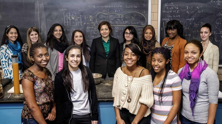 Engineering Professor Bahar Zohgi, rear center, with the young women...