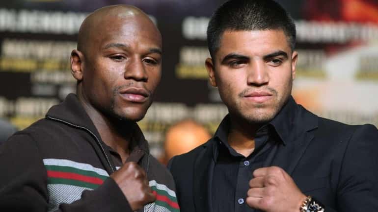 Floyd Mayweather and Victor Ortiz face off at a press...