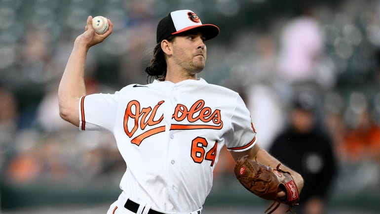 Baltimore Orioles starting pitcher Dean Kremer throws during the fourth...
