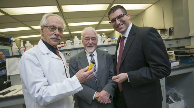 Stony Brook researchers and drug compound inventors, from left, Lorne...