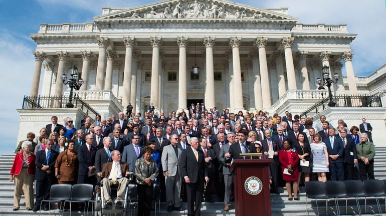 House Speaker Paul Ryan of Wis., joined by House members,...