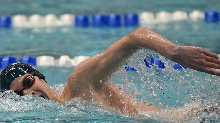 Jake Newmark of Garden City competes in the 200-yard freestyle...