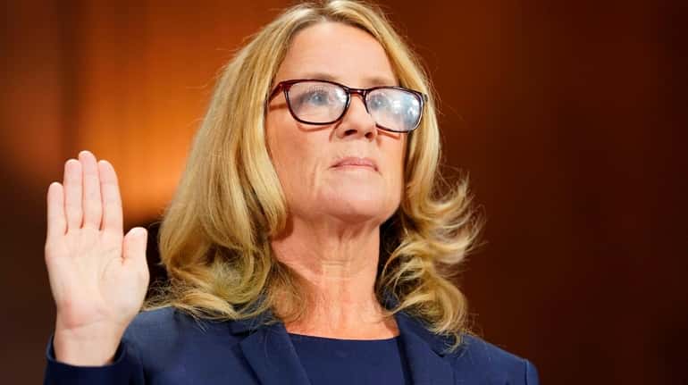 Christine Blasey Ford is sworn in to testify before the...