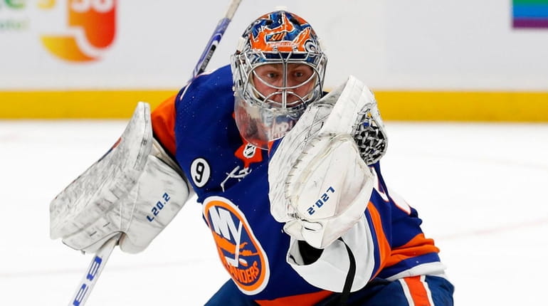 Semyon Varlamov #40 of the Islanders makes a glove save...
