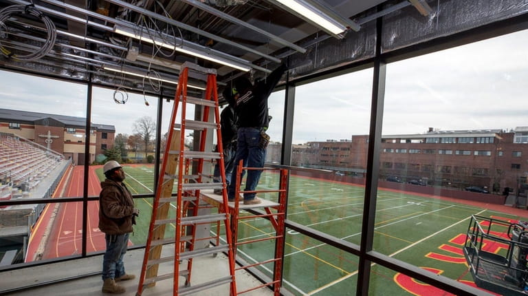 Construction crews work on Chaminade High School's Science, Technology and...