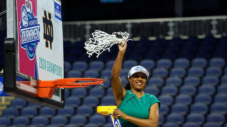 Notre Dame head coach Niele Ivey waves the net after...