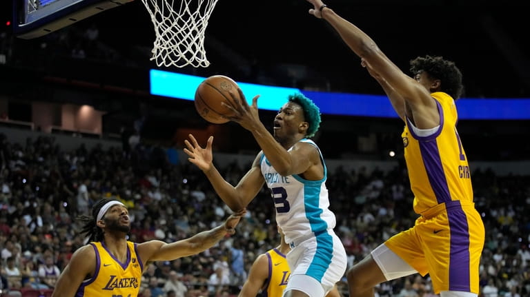 Charlotte Hornets' Kai Jones grabs a rebound against Los Angeles...