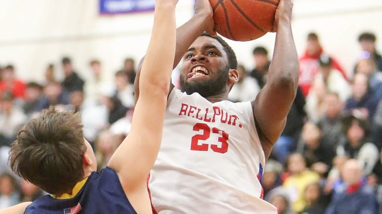 Bellport's Samir Bell scores while covered by Northport's Quinn Reynolds  in...
