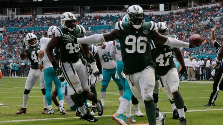 Jets defensive end Muhammad Wilkerson celebrates an interception during the...