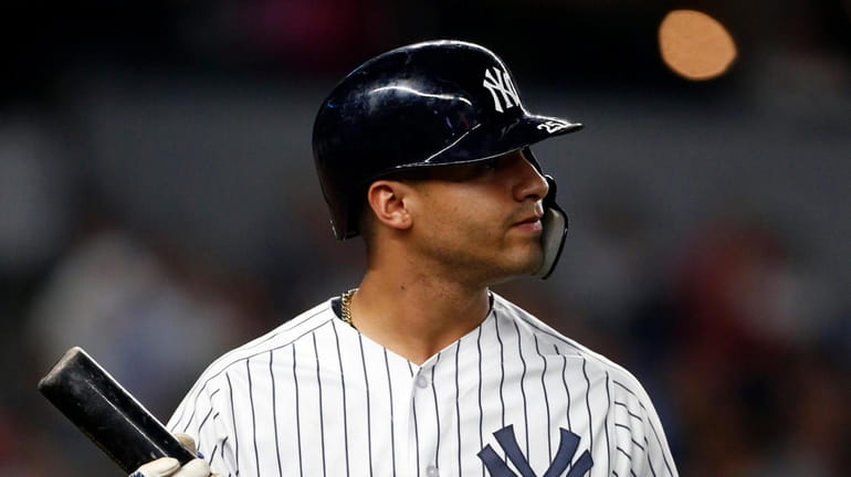 Gleyber Torres #25 of the Yankees looks on after fouling...