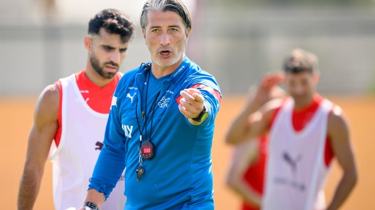 Switzerland's head coach Murat Yakin gestures during an open training...