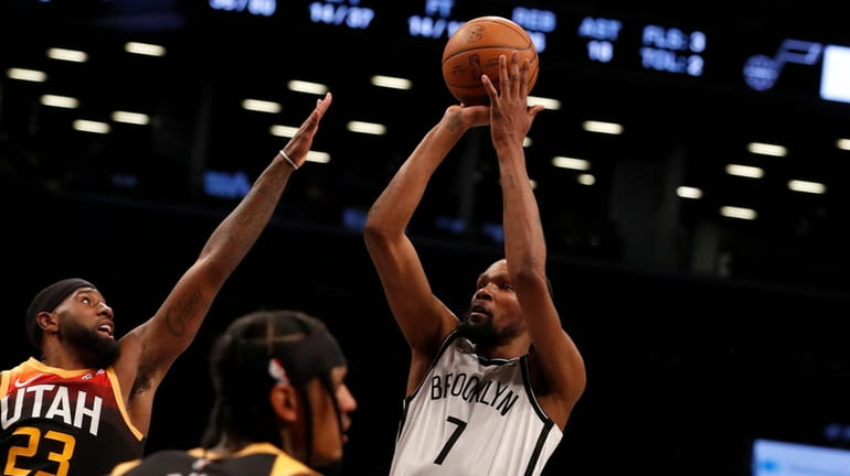 Kevin Durant #7 of the Nets puts up a shot...