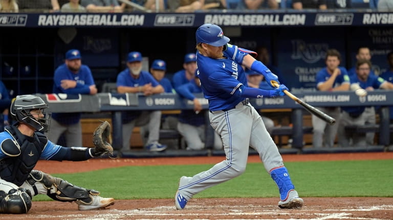 Toronto Blue Jays' Justin Turner hits a two-run double next...