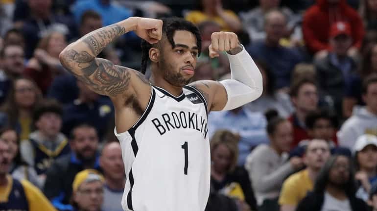 Nets' guard D'Angelo Russell reacts after a Brooklyn basket during...