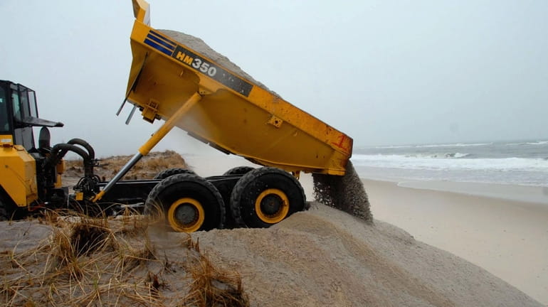 Sand is dumped on Robert Moses State Park Field 5...