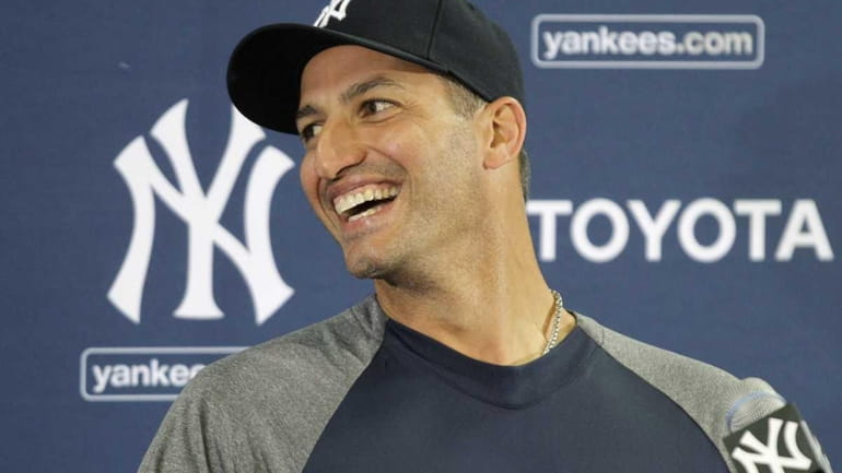 Andy Pettitte speaks to reporters after arriving at the Yankees...