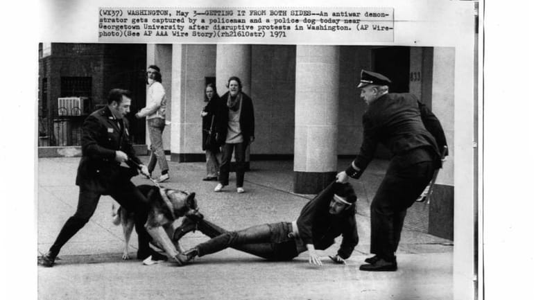 Police remove a protester at an anti-Vietnam War demonstration in...