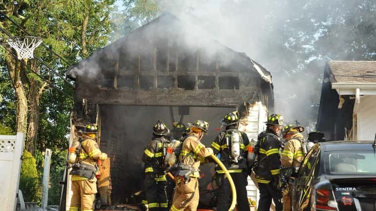 Three volunteer firefighters with the Dix Hills Fire Department sustained...