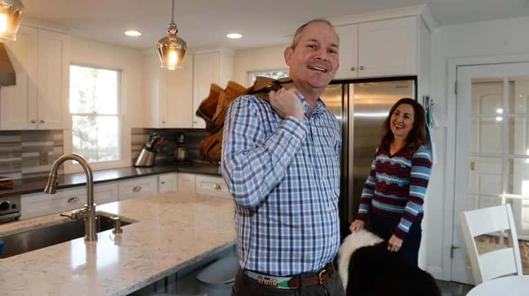 Robert and Susan Grubman in their newly renovated Syosset kitchen, which...