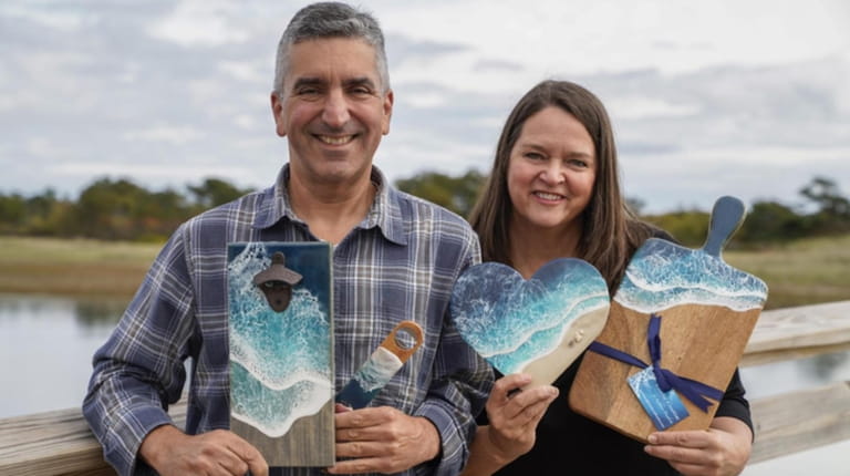Kathleen and Joe Desiderio, co-owners of Coastal Creations, pose with...