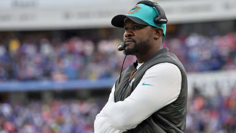 Dolphins head coach Brian Flores watches from the sideline during...