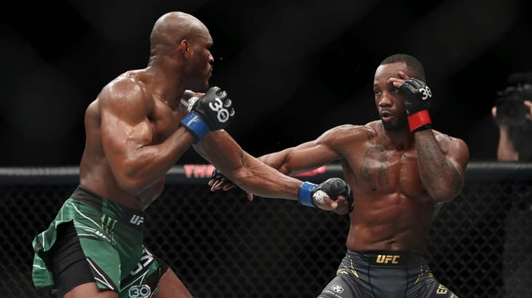 Leon Edwards, right, faces off against Kamaru Usman during their...