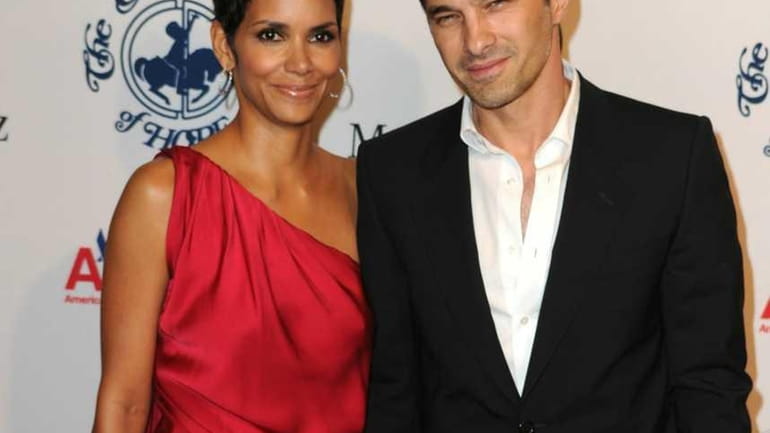Halle Berry and Olivier Martinez arrive at the 32nd Anniversary...