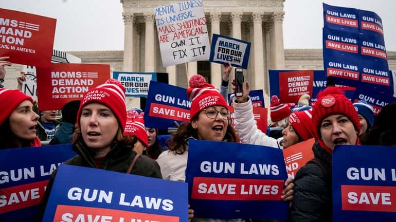 Gun safety advocates rally in front of the U.S. Supreme...