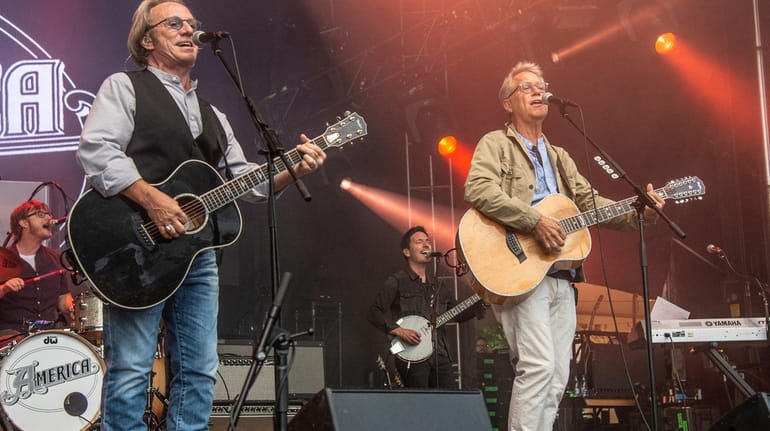 Dewey Bunnell, left, and Gerry Beckley of America perform during the...