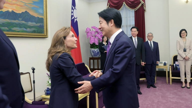 In this photo released by the Taiwan Presidential Office, Lisa...