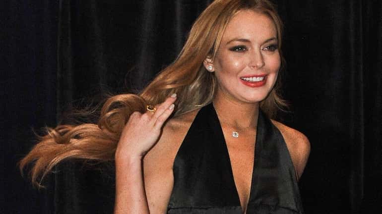 Lindsay Lohan arrives at the annual White House Correspondents' Association...