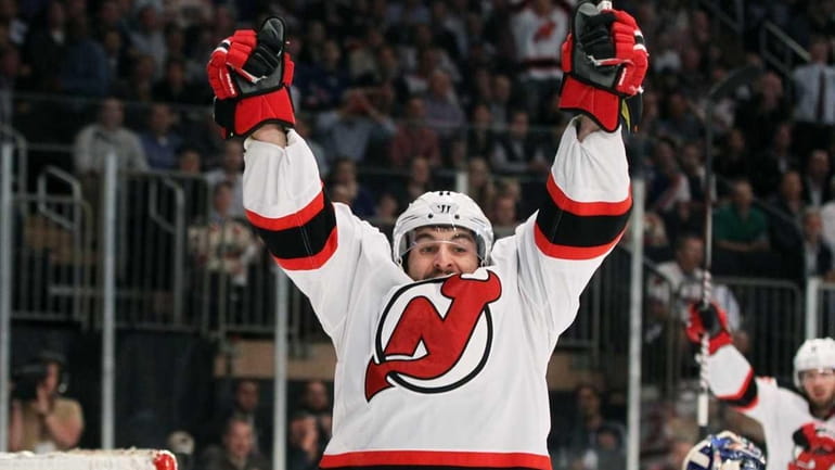 Stephen Gionta #11 of the New Jersey Devils celebrates scoring...