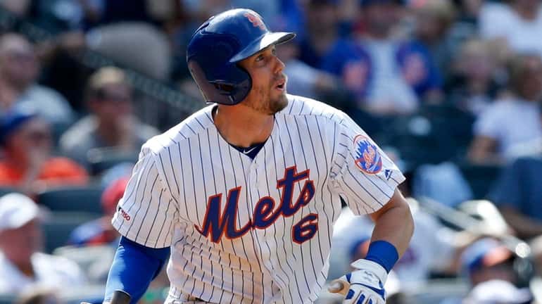 Mets second baseman Jeff McNeil doubles during the seventh inning against...