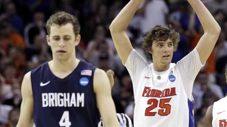 Florida's Chandler Parsons (25) reacts in front of BYU's Jackson...