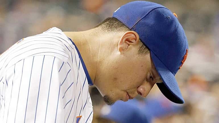 Mets shortstop Wilmer Flores in the dugout during a game...