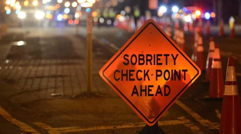 Nassau police conduct a DWI checkpoint on Jan. 1, 2014,...