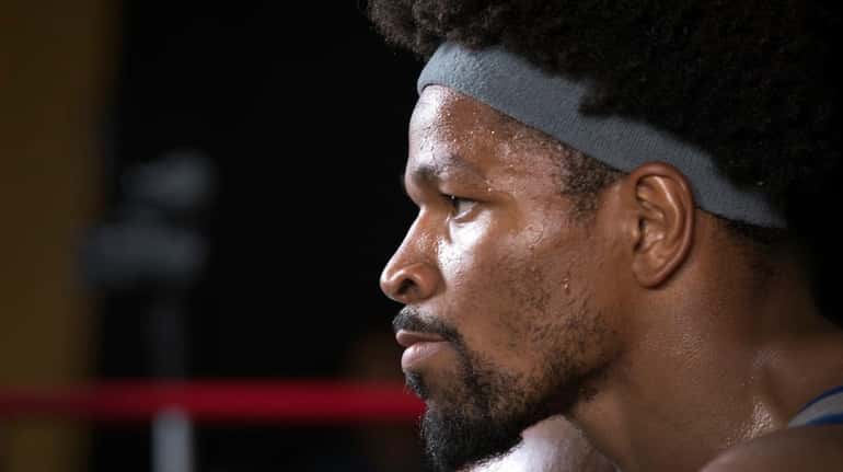 Shawn Porter looks into a mirror during a workout in...