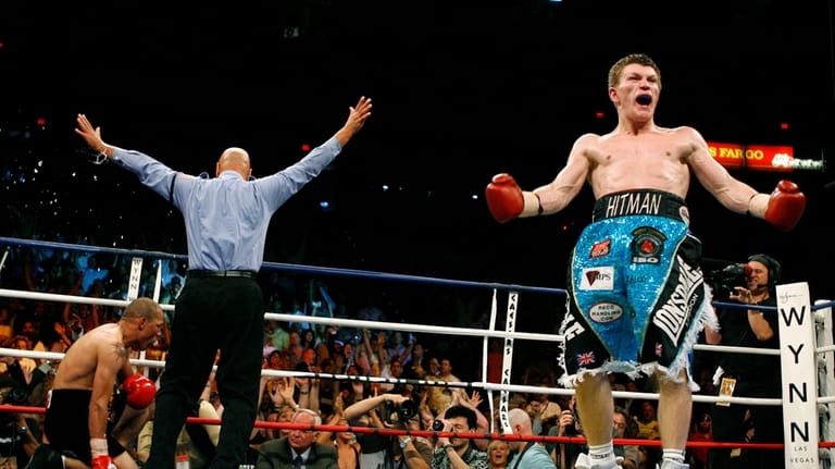 Ricky Hatton right, of Manchester, England, celebrates a fourth-round knockout...