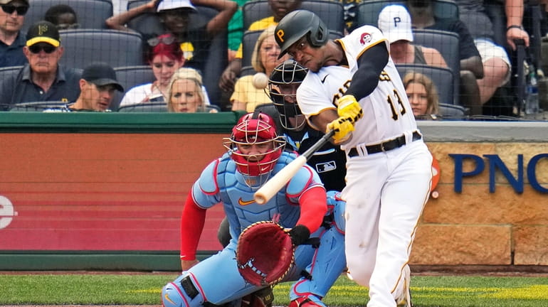Pittsburgh Pirates' Ke'Bryan Hayes (13) hits a solo home run...