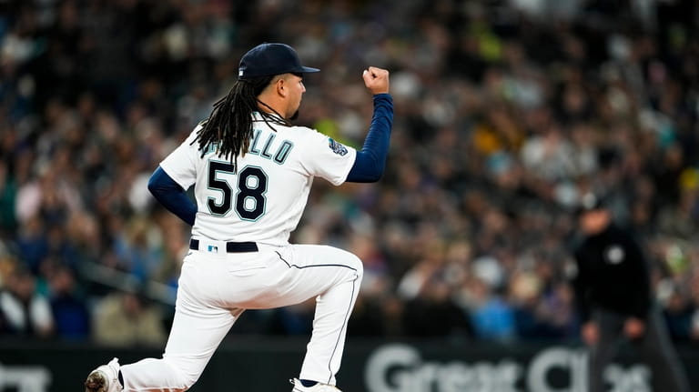 Seattle Mariners starting pitcher Luis Castillo reacts after the top...