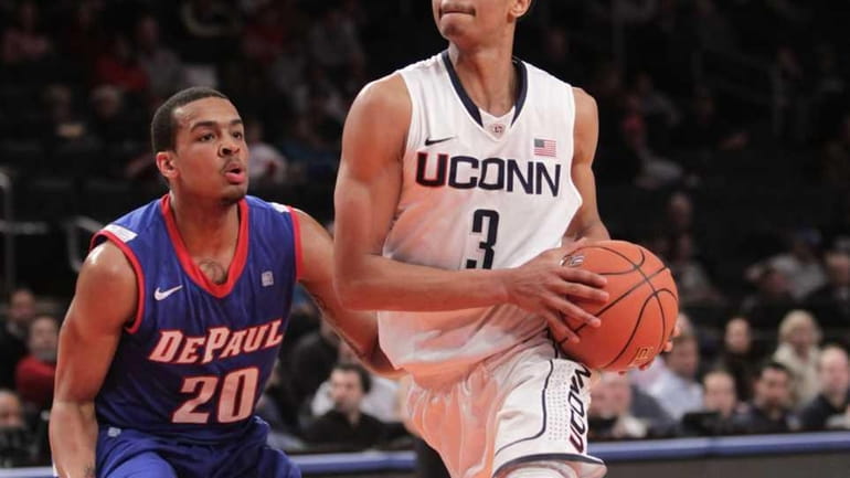 Connecticut's Jeremy Lamb moves around DePaul's Brandon Young during the...