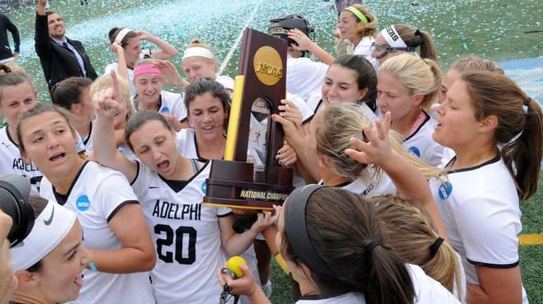 The members of the Adelphi women's lacrosse team celebrate with...