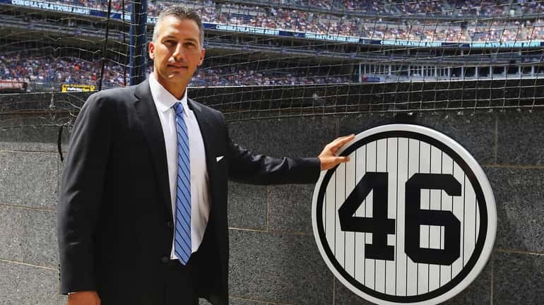 Former pitcher Andy Pettitte of the New York Yankees stands...