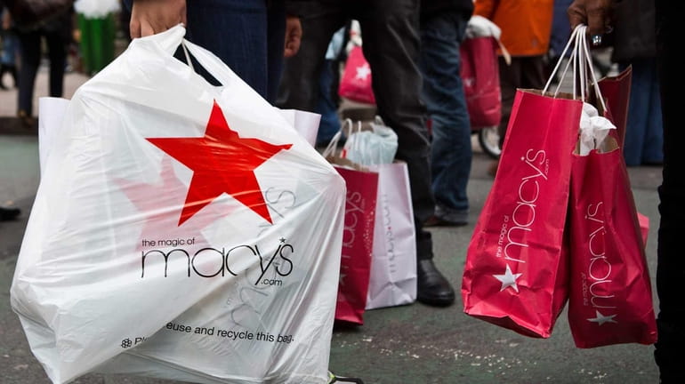 Shoppers flood Manhattan stores such as Macy's for post-Christmas deals....
