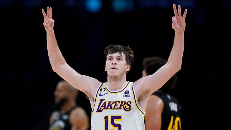Los Angeles Lakers' Austin Reaves celebrates his three-point basket during...