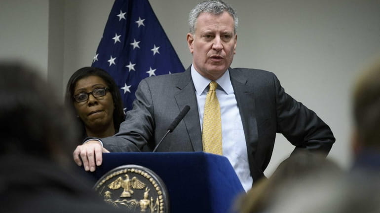 New York City Mayor Bill de Blasio answers reporters' questions...
