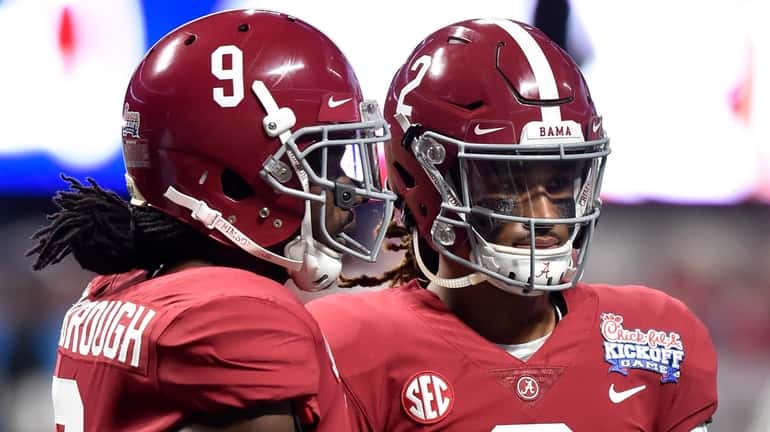 Bo Scarbrough #9 and Jalen Hurts #2 of the Alabama...
