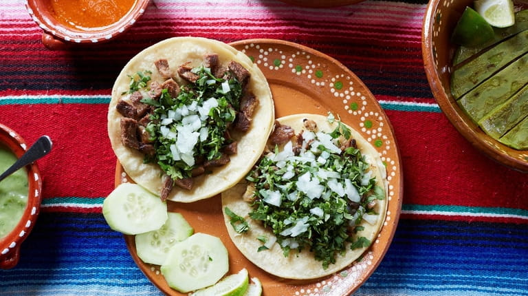 Tacos filled with cecina (head cheese) and lengua (tongue) at...