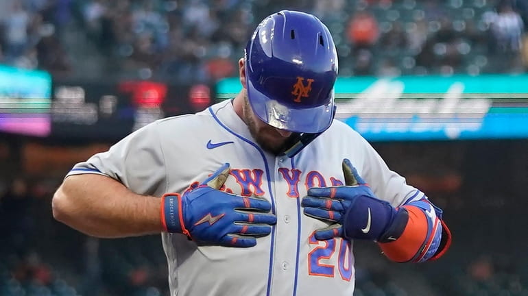 The Mets' Pete Alonso celebrates after hitting a three-run home...