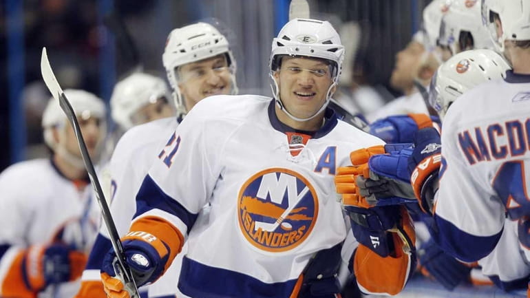 New York Islanders right wing Kyle Okposo (21) celebrates with...
